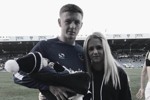 Dion Donohue with his wife Nadine and son Mason on the touchline at Fratton Park