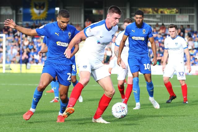 Oli Hawkins retains possession against AFC Wimbledon. Picture: Joe Pepler