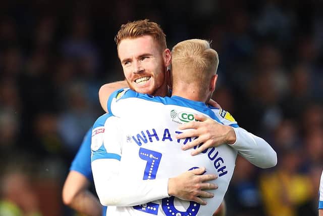 Tom Naylor embraces Jack Whatmough after his opening goal in Pompeys 2-1 win at AFC Wimbledon. Picture: Joe Pepler