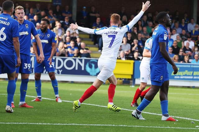 Tom Naylor celebrates his goal from a corner in the win over AFC Wimbledon. Picture: Joe Pepler