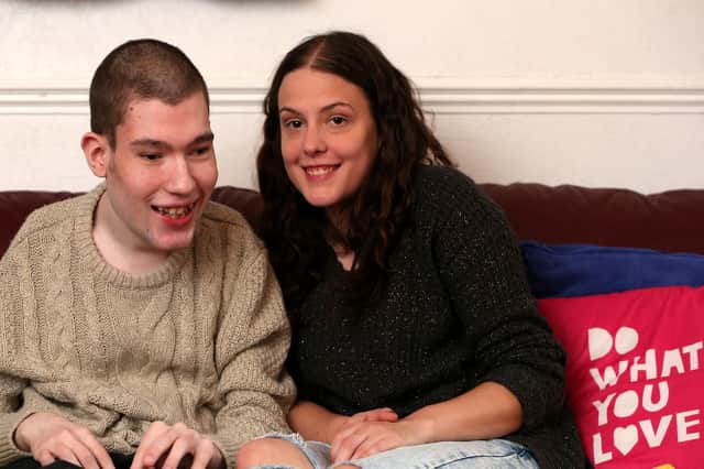 Rob Ayling and his sister, Elizabeth Ayling, who looks after him, pictured in their home in Havant Picture: Chris Moorhouse