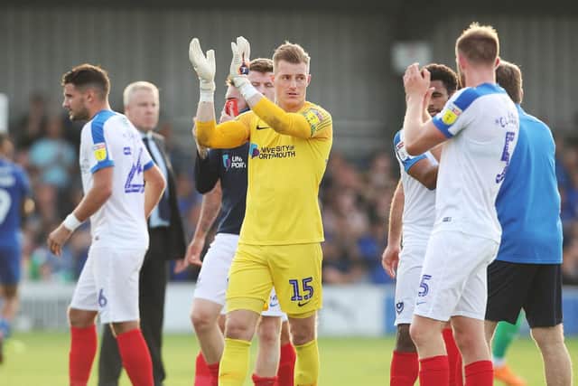 Pompey celebrate their latest away win at AFC Wimbledon. Picture: Joe Pepler