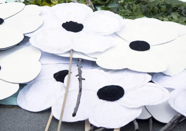 St John Ambulance volunteers will be able to wear white poppies this year