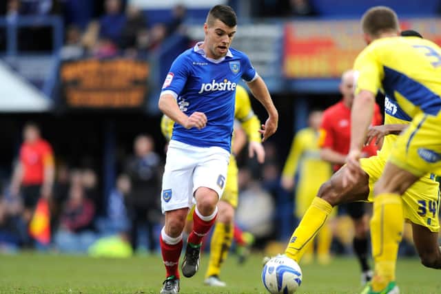 Liam Walker takes on Bury in March 2013 during his time at Pompey