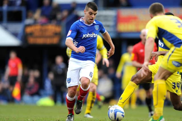Liam Walker takes on Bury in March 2013 during his time at Pompey
