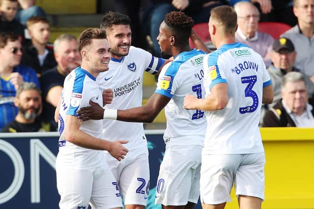 Pompey celebrate Gareth Evans' goal against Wimbledon Picture: Joe Pepler