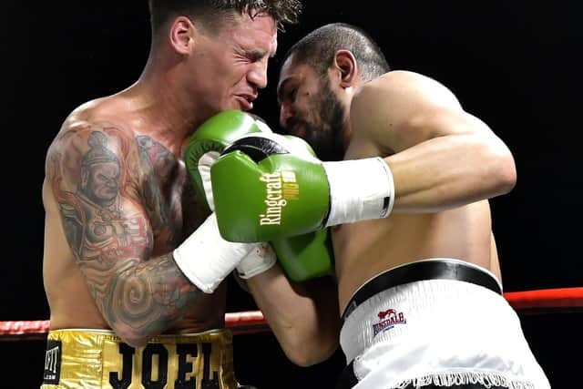 Joel McIntyre in action against Tayar Mehmed Picture: Neil Marshall