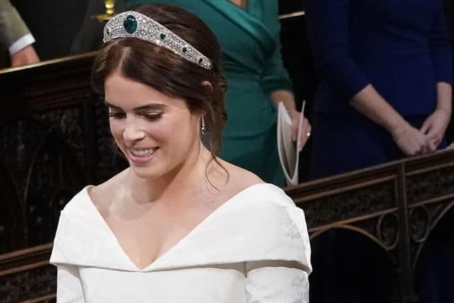 The wedding of Princess Eugenie, her mother Sarah Ferguson and sister Beatrice are in the background.