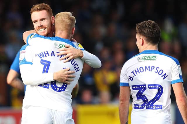 Tom Naylor, left, celebrates his maiden Pompey goal after 15 appearances. Picture: Joe Pepler