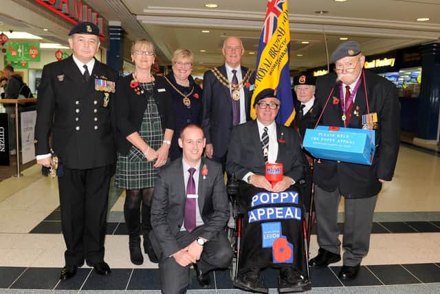 The launch of the Poppy Appeal in Fareham in 2015. Back, from left, Tony Crisp, Royal Naval Association Bugler, Sylvie Hasson, centre administrator, the Mayoress of Fareham Anne Ford, the Mayor of Fareham Mike Ford, Angela McDougal and Ted Burridge with (front l-r) Mike Taylor, centre manager and Mike Homer, Poppy Appeal organiser.