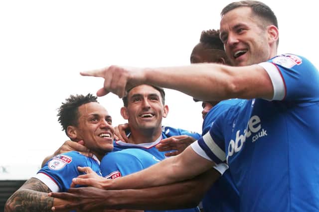 Pompey celebrate Kyle Bennett's goal during the 6-1 victory over Cheltenham. Picture: Joe Pepler