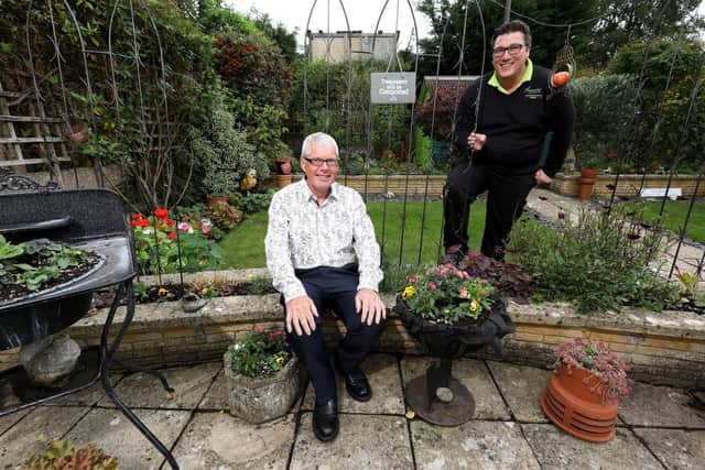 Bloomin' Marvellous winner Ray Hunt, left, and plantsman Callum Hartley from Garsons of Titchfield, in Mr Hunt's Waterlooville garden. Picture: Chris Moorhouse