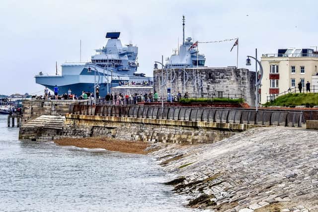 HMS Queen Elizabeth leaving Portsmouth Harbour in June. Picture: Trev Harman
