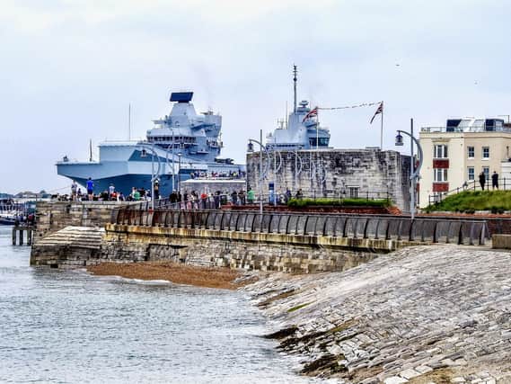 HMS Queen Elizabeth leaving Portsmouth Harbour in June. Picture: Trev Harman