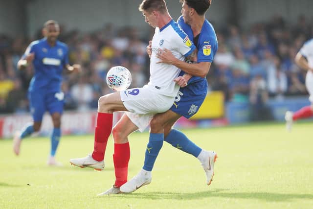 Oli Hawkins holds the ball up against AFC Wimbledon on Saturday. Picture: Joe Pepler