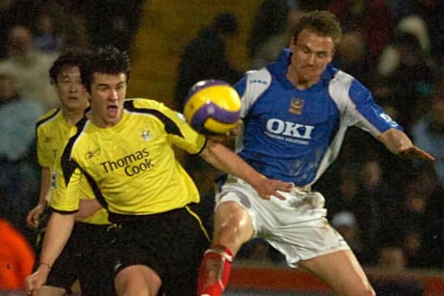 Joey Barton battles Pompey's Matt Taylor for the ball during his Manchester City playing days.