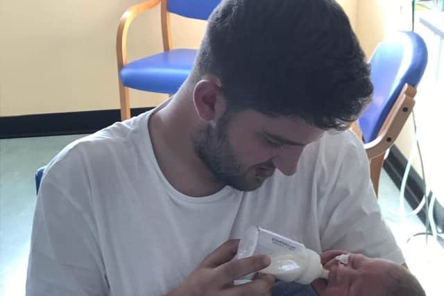 Jordan Osborne with his baby son, Jaxon