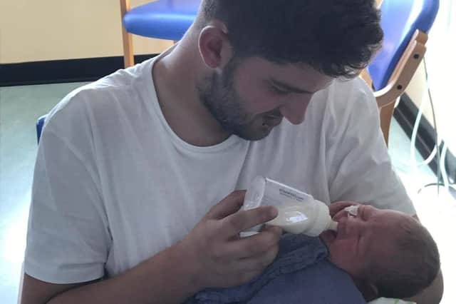 Jordan Osborne with his baby son Jaxon