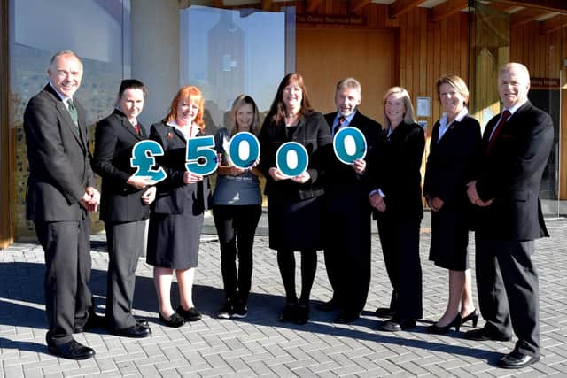Colleagues from the Oaks Crematorium with representatives from Over the Wall. Picture: Southern Coop