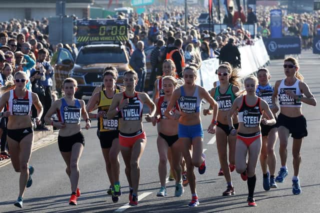Eilish McColgan, right centre, leads the elite women out from the start line at the Great South Run Picture: Chris Moorhouse
