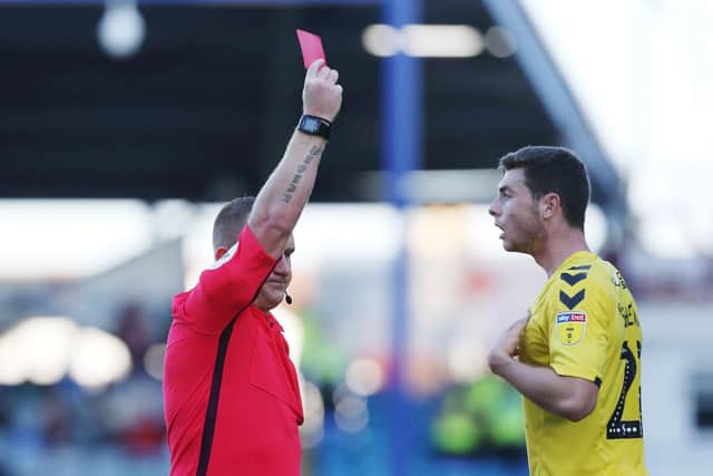 Referee Lee Swabey sent off Nathan Sheron six minutes from time in Fleetwood's Fratton Park defeat. Picture: Joe Pepler