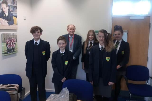 Colin Chambers surrounded by (l to r front) Kai O'Connor, 12, William Smith, 12, Mary Jane, 13. Back (l to r) Coral Harland, 13 and Ruby Stjohn, 13.
