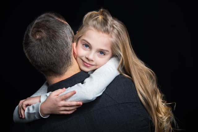 What's wrong with dads hugging their sons or daughters?