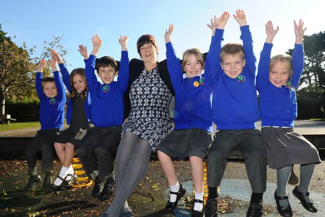 Peel Common Nursery and Infant School - (l-r) Freddie-Ray Atkinson (5), Georgie Civil (5), Joshua Clelland (6)), Lesley Spicer, headteacher, Joanna Pethick (7), Albie Cripps (6) and Hollie Pownall (4).