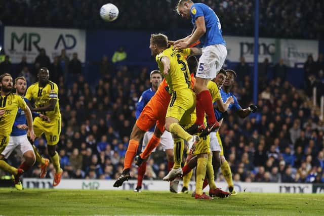 Matt Clarke heads in Pompey's equaliser. Picture: Joe Pepler