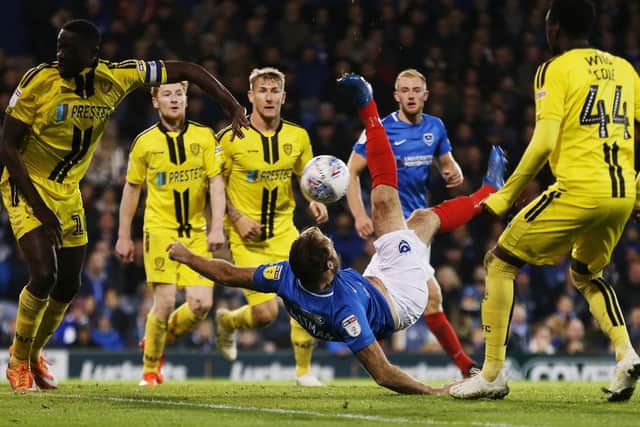 Matt Clarke looks on as substitute Brett Pitman attempts an overhead kick Picture: Joe Pepler