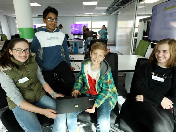 From left, Emily Miles, 11, Roser Rahman, 13, Finn Brook-Holmes, 11, and Isabella McGowan, 11, take part in the CyberFirst Adventurers event.