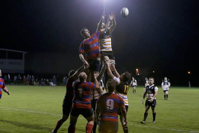 Last year United Services and Portsmouth met under lights in the Hampshire bowl quarter-final. Picture: Habibur Rahman