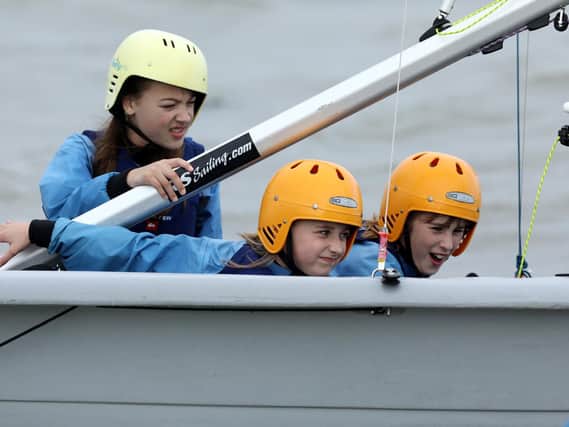 From left, Jessica Shillingford, Clara Scott-Joynt and Lili Sharpe, all 11. Children from Priory School, Southsea, take part in the Sailwise Project at the Andrew Simpson Watersports Centre Picture: Chris Moorhouse