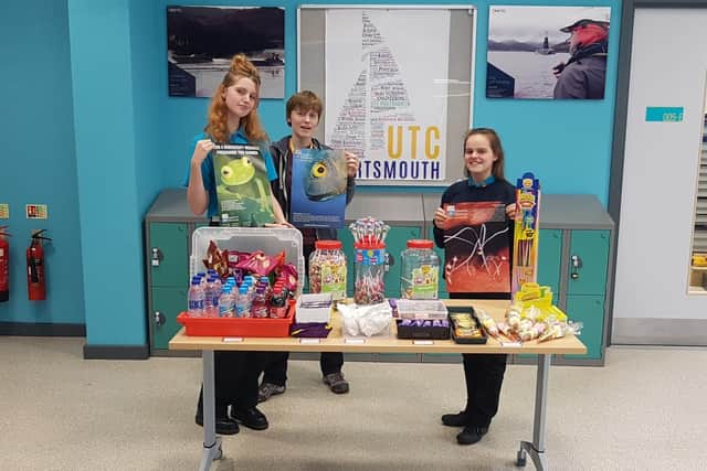 Lauren McAuley (far right) alongside two other students running the fund raiser tuck shop