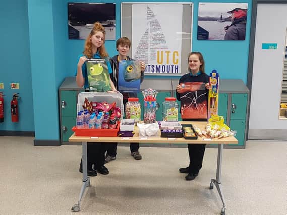 Lauren McAuley (far right) alongside two other students running the fund raiser tuck shop