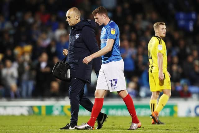 Dion Donohue leaves the action early against Burton Albion Picture: Joe Pepler