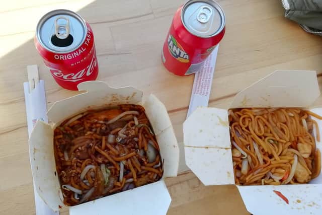Black bean noodles, left, next to egg noodles with chicken and mushroom.