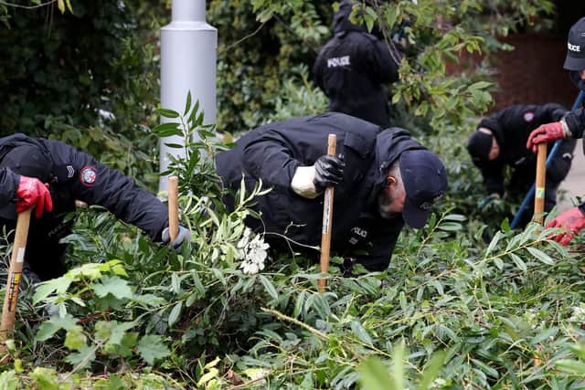 Police officers search an area near the Orchard Theatre in Dartford, Kent as the investigation continues in to the disappearance of mother-of-five Sarah Wellgreen who has not been seen since October 9. Picture: PA