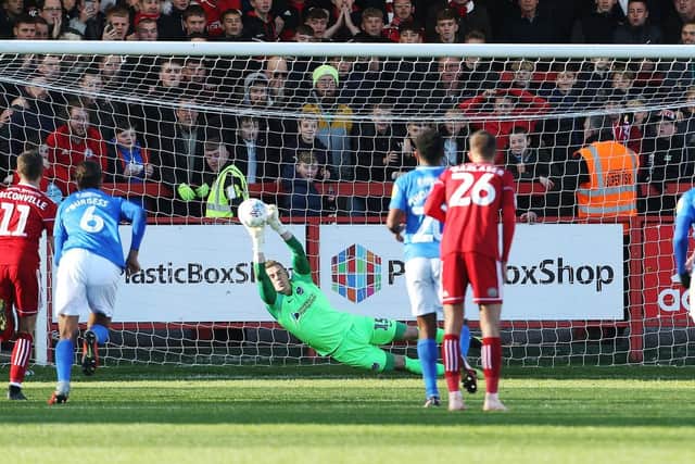 Craig MacGillivray saves Billy Kee's first-half penalty in Saturday's 1-1 draw. Picture: Joe Pepler