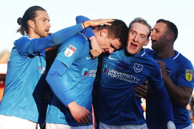 Ronan Curtis, right centre, congratulates Oli Hawkins for his goal against Accrington Picture: Joe Pepler