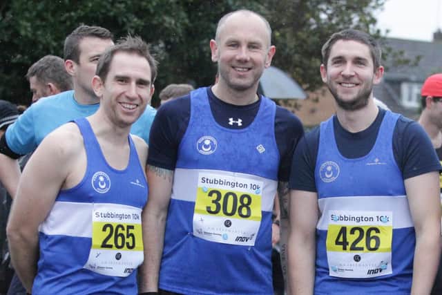 Barry Griffin, centre, has now completed his century of parkruns. Picture: Habibur Rahman