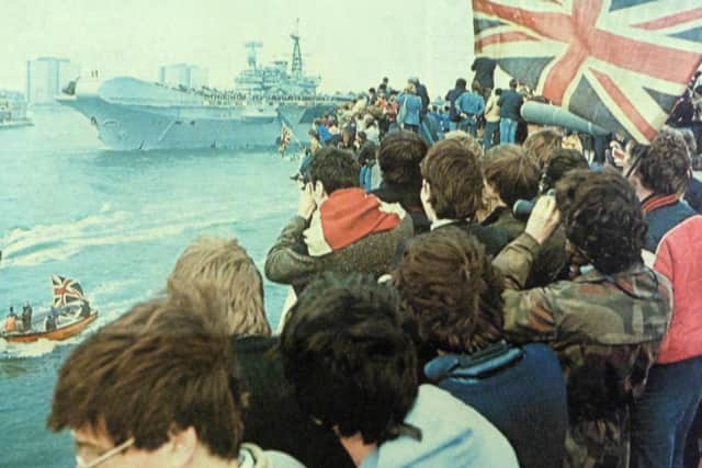HMS Hermes leaves Portsmouth Harbour, bound for the Falklands, and cheered on her way by a flag-waving crowd