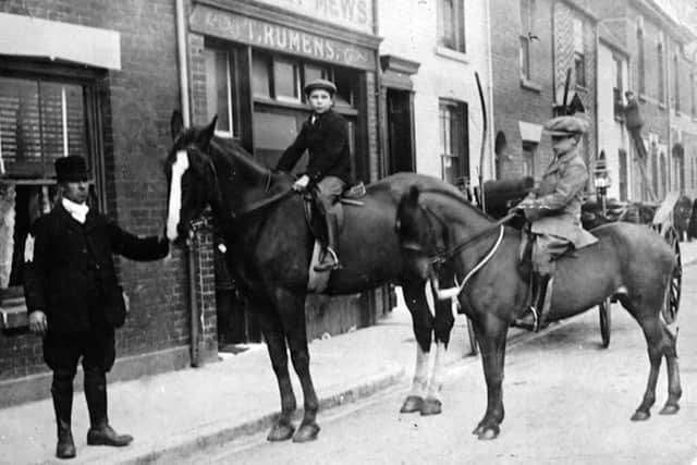 Thomas Rumen with two of his sons in a photo possibly taken in Station Street off Commercial Road, Portsmouth. Picture: Barry Cox Collection.
