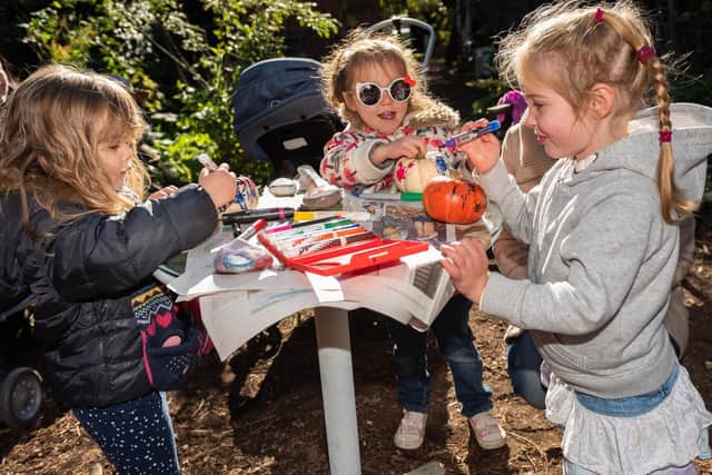 From left, Skye Tremain (3), Lyra Warner (4) and Alice Gallie (3) from Southsea decorating their mini pumpkins. Picture: Vernon Nash