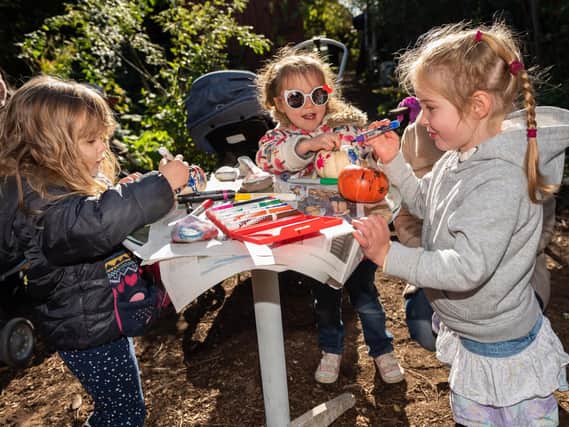 From left, Skye Tremain (3), Lyra Warner (4) and Alice Gallie (3) from Southsea decorating their mini pumpkins. Picture: Vernon Nash