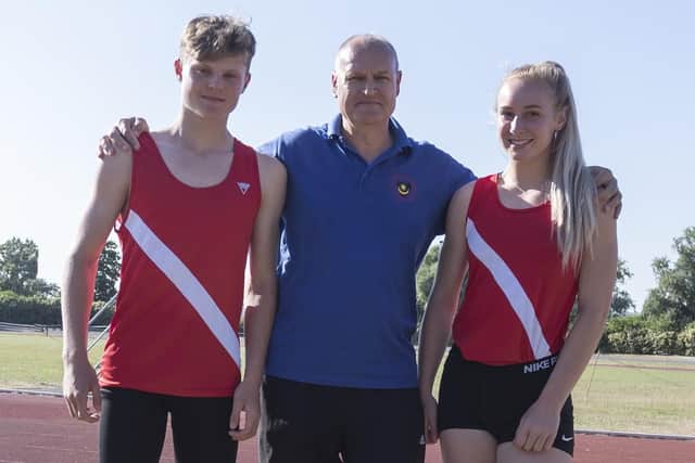 Elliott Evans, left, with his coach Terry Price and training partner Hollie Thurgood. Picture: Paul Smith