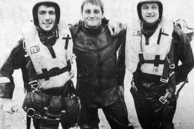 Paul Coleman, instructor Mac McLaughlin and James Wild came ashore near South Parade Pier after their sponsored parachute jump.