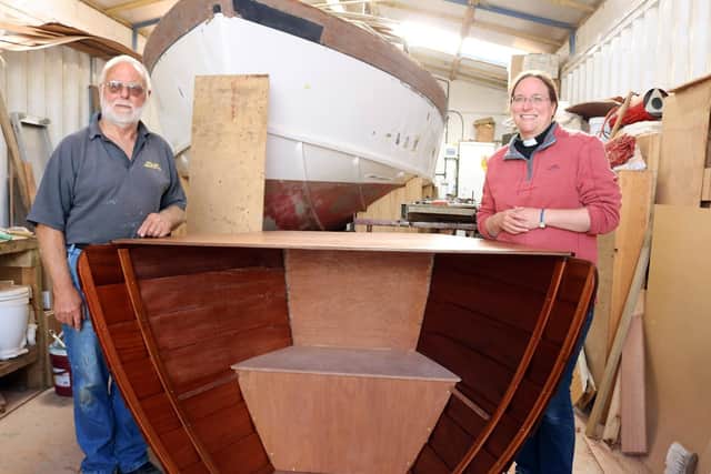 Boat-builder Derek Abra shows the altar he made in his workshop to the vicar of Hayling Island, the Rev Jenny Gaffin