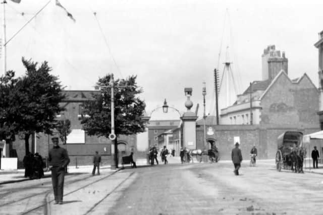 Can anyone tell me anything about the mast on the right inside the dockyard main gate? Picture: Barry Cox Collection.