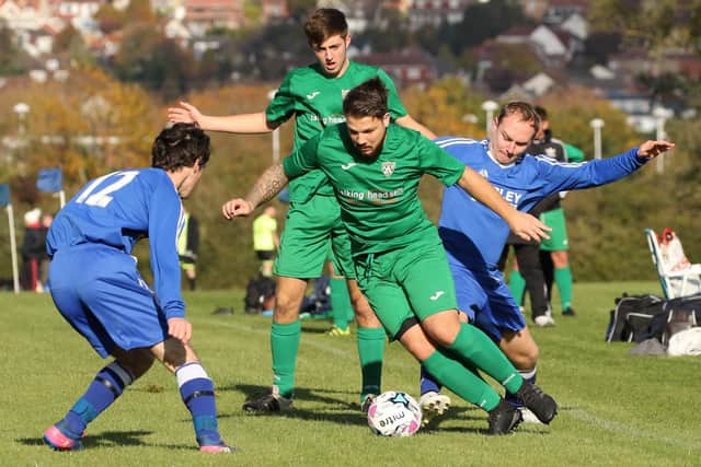 AFC Southbourne, green, hit the summit of the Portsmouth Sunday League senior division after beating Kerley Builders 6-0. Picture: Kevin Shipp